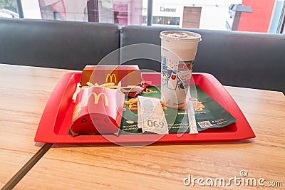 McRib menu in McDonald`s restaurant. McRib is a barbecue-flavored pork sandwich Editorial Stock Photo