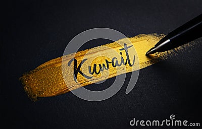 Kuwait Handwriting Text on Golden Paint Brush Stroke Stock Photo