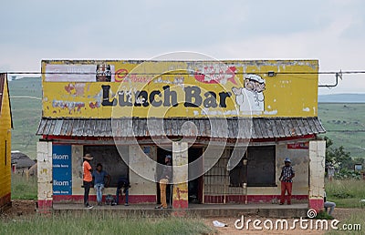 Kwazulu Natal, South Africa. Lunch Bar, cafe, take away with yellow sign, photographed in a rural village. Editorial Stock Photo