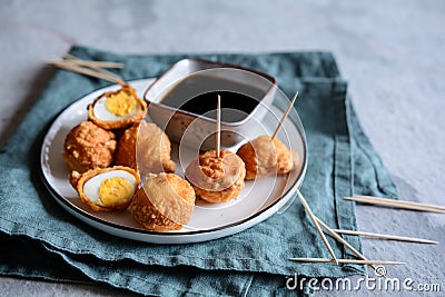 Kwek Kwek - deep fried quail eggs coated with batter served with soya sauce and vinegar dip Stock Photo