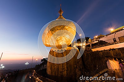 Kyaikhtiyo or Kyaiktiyo pagoda, Golden Rock, Myanmar with pilgrims during sunset Editorial Stock Photo