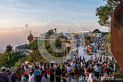 Pilgrims in the square of the Golden Rock Pagoda Editorial Stock Photo