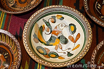 Kyiv-Pechersk Lavra museum, Ukraine - 07.06.2016: ancient Ukrainian handmade and handpainted ceramic clay plate Editorial Stock Photo