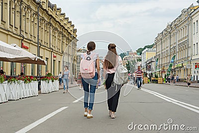 Kyiv UA, 19-07-2018. Young teenage girls students are walking through the streets of the city, the view from the back Editorial Stock Photo