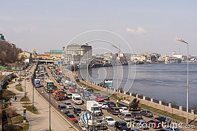 Kyiv, Ukraine- April 1, 2021: Automobile collapse at the highway along Dnipro River. Traffic jam with rows of cars on Editorial Stock Photo