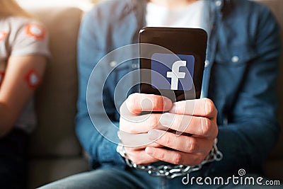 KYIV, UKRAINE - APRIL 26, 2019: Facebook logo. illustration. Facebook icon. Young man and woman have social media Cartoon Illustration