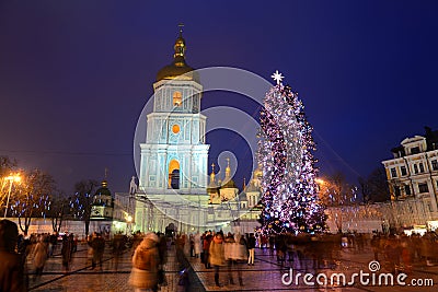 The group of people and the Bell Tower of Saint Sofias Cathedral and New Year Tree Editorial Stock Photo