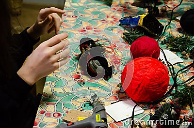 Kyiv, Ukraine - February 14, 2022. Children make products from threads. Teenage caucasian girls make crafts. Master class for Editorial Stock Photo