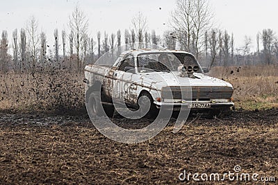 Retro car GAZ 24 Volga on a country road outside the city. Editorial Stock Photo