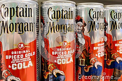 Kyiv, Ukraine, 13 July, 2023: - Cans of Captain Morgan Spiced Gold Rum-Cola brand of luxury cocktail for sale Editorial Stock Photo