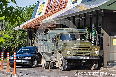 A large heavy truck is standing in a fast food restaurant. Editorial Stock Photo