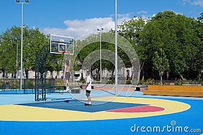 Teenagers plays streetball at new sport zone at expocenter, Kyiv, Ukraine Editorial Stock Photo