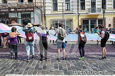 Kyiv, Ukraine - June 23, 2019. March of equality. LGBT march KyivPride. Gay parade. People unfurled a huge rainbow flag Editorial Stock Photo