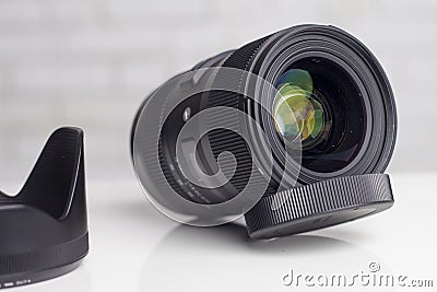 KYIV, UKRAINE - June 15, 2017: Sigma 18-35mm f / 1.8 DC HSM lens for Canon EF. Front lens Editorial Stock Photo