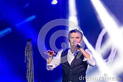 KYIV, UKRAINE - JUNE 21: Svyatoslav Vakarchuk on concert of Okean Elzy on JUNE 21 2014 in NSC Olimpiyskiy. Final concert of world Editorial Stock Photo