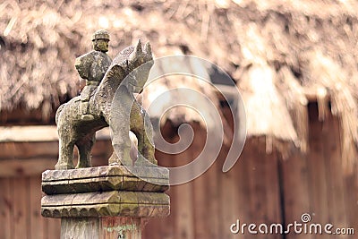 Village gate post carved with a rider. Mamaeva Sloboda Editorial Stock Photo