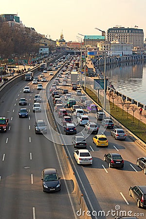 Automobile collapse at the highway along Dnipro River. Traffic jam with rows of cars on motorway in the week-end day in Kyiv Editorial Stock Photo