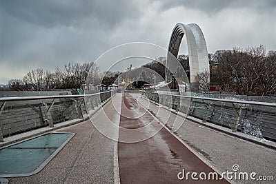 Kyiv, Ukraine - March, 22, 2020: Pedestrian-bicycle bridge in Kiev. A popular place of the city Editorial Stock Photo