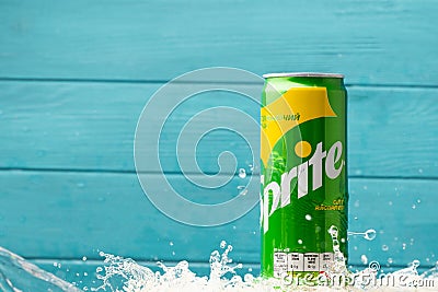 KYIV, UKRAINE - May 13: Close up shot of water splash over classic Sprite green can on the turquoise wooden background. Popular Editorial Stock Photo