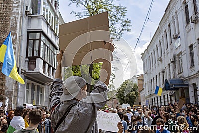 KYIV, UKRAINE - May 21 2021: man holding a poster on a protest action against police`s abuse of power. The protesters demand an Editorial Stock Photo