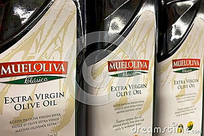 Kyiv, Ukraine 28.07.2023: - Mueloliva olive oil in glass bottles in shelf in supermarket for sale Editorial Stock Photo
