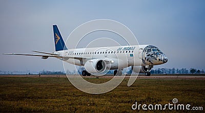 Kyiv, Ukraine - November 14, 2019: Airplane Embraer-190-E2 in the snow leopard livery. Airbrushing on the cockpit Editorial Stock Photo