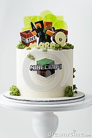 Birthday cake for a Minecraft video game fanboy decorated with transparent caramel candies, edible Editorial Stock Photo