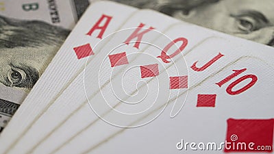 Kyiv,Ukraine - October 2023. Royal flush poker combination with dollars profit. Playing cards, casino concept Editorial Stock Photo