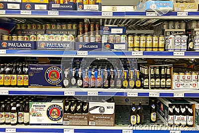 Kyiv, Ukraine 28.07.2023: - Paulaner beer brand stacked on large packs on shelw in supermarket Editorial Stock Photo