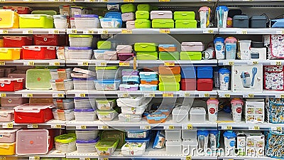 Kyiv, Ukraine - 4 September, 2023: Inside the Auchan supermarket. Showcase with plastic containers Editorial Stock Photo