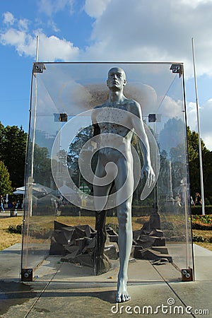 Interactive sculpture of a man at Expocenter. It changes its color to blue when touched by peo Editorial Stock Photo