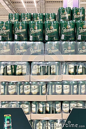 Kyiv, Ukraine 28.07.2023: - Staropramen beer cans stacked on large packs in supermarket Editorial Stock Photo