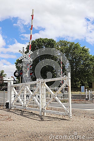 Kyneton railway station has the last set of mechanically interlocked swing gates in Victoria Stock Photo