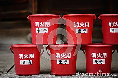 Red water cans are arranged in Toji Temple, just in case there is a fire Editorial Stock Photo
