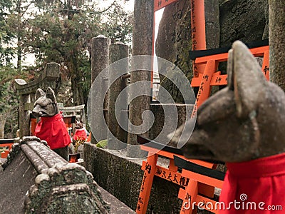 Foxes stone statue at Fushimi Inari Shrine in Japan Editorial Stock Photo