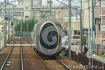 Kyoto, Japan - 01/03/2020 : Japanese railway with a local train run through city. Tourist attraction in travel and transportation Editorial Stock Photo