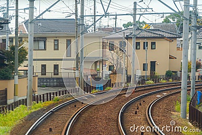 Kyoto, Japan - 01/03/2020 : Japanese railway with a local train run through city. Tourist attraction in travel and transportation Editorial Stock Photo