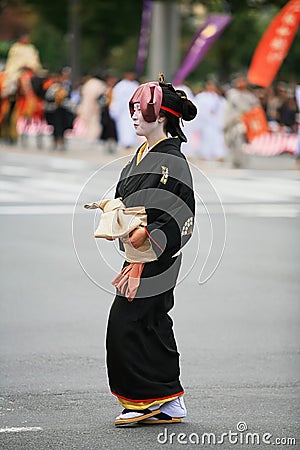 The wife of Nakamura Kuranosuke in the black elegant kimono at Jidai Festival. Kyoto. Japan Editorial Stock Photo