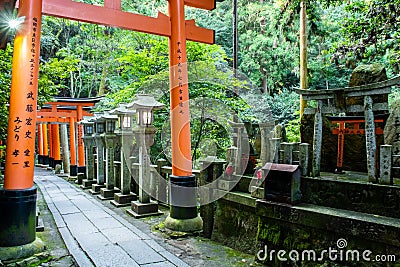 KYOTO, Japan. Path under the famous red wooden torii gates in Fushimi Inari-Taisha Shinto Shrine in Kyoto. Editorial Stock Photo
