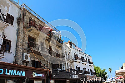 Old stone house, hotel, cafes and restaurants on the embankment of The Kyrenia Harbor Editorial Stock Photo