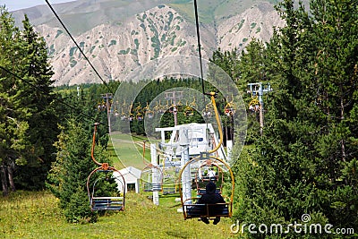 Kyrgyzstan, Karakol ski resort - August 22, 2022. Summer mountain landscape high in the mountains. Tall trees of Christmas trees, Stock Photo
