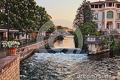 L`Isle-sur-la-Sorgue, Vaucluse, Provence-Alpes-Cote d`Azur, France: landscape at dawn of the city surrounded by water canals Stock Photo