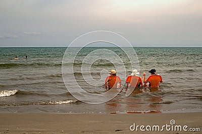 Three old ladies sea bathing in the Caribbean Editorial Stock Photo