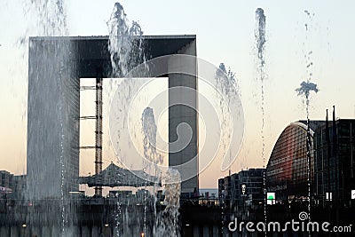 Paris business district La defense Grande arche water jet at winter sunset france. Editorial Stock Photo