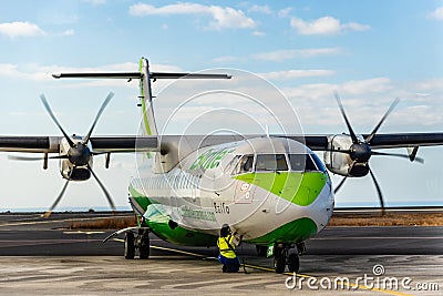 Propeller airplane provisioning on the runway Editorial Stock Photo