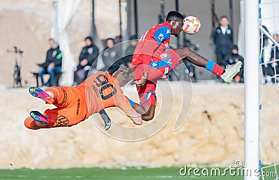 Viktoria Plzen striker Rafiu Durosinmi and Ferencvaros goalkeeper Denes Dibusz during club friendly Ferencvaros vs Viktoria Plzen Editorial Stock Photo