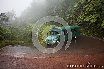 A green vintage bus in the La Paz Waterfall Gardens, Costa Rica Editorial Stock Photo