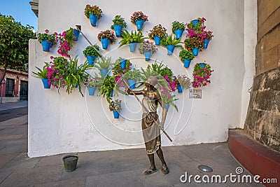 La Regadora (Watering Can Lady) - Monument to yard caretakers - Cordoba, Spain Editorial Stock Photo