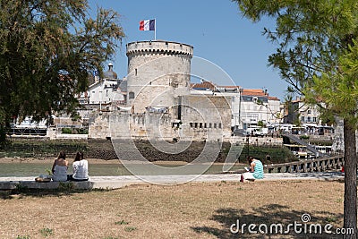 La Rochelle , Aquitaine / France - 11 19 2019 : entrance harbour towers of the old port in La Rochelle in France Editorial Stock Photo