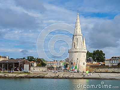Sailing dinghies at the dock ready to sail with a tower in the background in La Rochelle Editorial Stock Photo